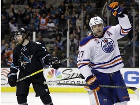 Edmonton Oilers' Milan Lucic (27) celebrates after scoring against the San Jose Sharks during the third period of an NHL hockey game Thursday, April 6, 2017, in San Jose, Calif.
