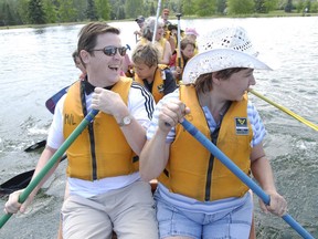 (left to right) Tony Semple along with fiance Shirley Jubinville share front rowing duties at the front of a Voyageur canoe while out at the River Day 2007 at Rundle Park Saturday afternoon.