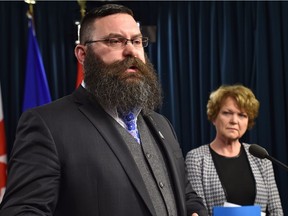 Municipal Affairs Minister Shaye Anderson along with Mary Martin, president of the Alberta School Boards Association, speak to the media about proposed amendments to the Municipal Government Act at the Legislature in Edmonton, Monday, April 10, 2017.