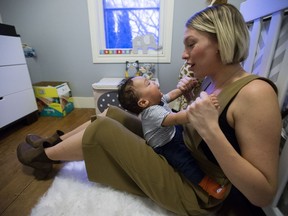 Julia Lipscombe and her son Indiana Lipscombe pose for a photo in their Edmonton home, Thursday Feb. 2, 2017. Photo by David Bloom