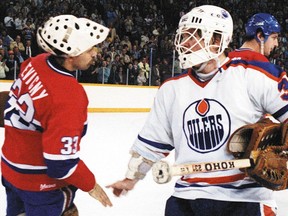 Oilers goalie Andy Moog and Canadiens counterpart Richard Sevigny shake hands after the 1981 playoff upset.