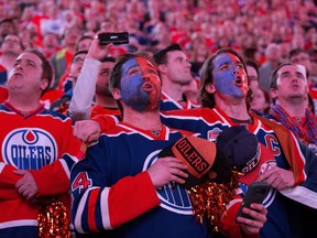 Oilers fans sing O Canada prior to the start of the Edmonton Oilers and San Jose Sharks NHL playoff game at Roger Place, in Edmonton Thursday April 20, 2017.