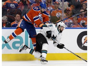 Edmonton Oilers forward Patrick Maroon takes San Jose Sharks' David Schlemko out of the equation at Roger Place in Edmonton on Thursday, April 20, 2017. (David Bloom)