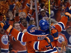 The Edmonton Oilers Patrick Maroon (19) and Connor McDavid (97) celebrate Maroon's goal against the San Jose Sharks during first period NHL playoff action at Roger Place, in Edmonton Thursday April 20, 2017.