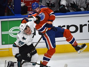 Edmonton Oilers defenceman Eric Gryba hits San Jose Sharks forward Timo Meier on April 12, 2017, during Game 1 of their first-round NHL playoff series at Rogers Place in Edmonton.