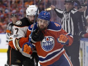 The Edmonton Oilers Kris Russell (4) battles the Anaheim Ducks Ryan Kesler (17) during third period NHL action at Rogers Place, in Edmonton Saturday April 30, 2017. Photo by David Bloom