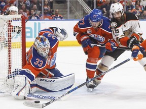 Anaheim Ducks' Patrick Eaves (18) vies for the puck with Edmonton Oilers' Oscar Klefbom (77) as goalie Cam Talbot (33) makes the save during first period NHL action in Edmonton, Alta., on Saturday, April 1, 2017.