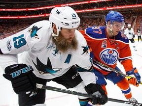 Connor McDavid of the Edmonton Oilers battles with Joe Thornton of the San Jose Sharks in Game Five of the Western Conference First Round during the 2017 NHL Stanley Cup Playoffs at Rogers Place on April 20, 2017 in Edmonton.