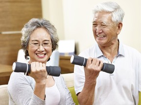 A senior couple exercises with some weights. A new study says seniors who involve themselves in intense exercise will reap the greatest rewards.