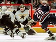 Edmonton Oilers forward Todd Marchant shoots the game winning goal on Dallas Stars goalie Andy Moog on April 29, 1997, in Game 7 of their Western Conference quarterfinal.