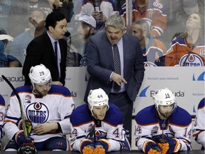 Edmonton Oilers head coach Todd McLellan, right, instructs his team during the third period in Game 3 of a first-round NHL hockey playoff series against the San Jose Sharks Sunday, April 16, 2017, in San Jose, Calif. Edmonton won, 1-0, in Game 3.