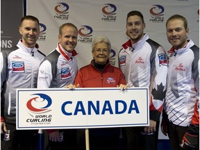Mexican curling enthusiast Gabriel Fernandez, centre, poses with Team Canada at the 2017 Ford Men's World Curling Championship at Northlands Coliseum in Edmonton.