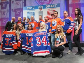 Mark Napier, centre row extreme left, and defence lawyer Brian Beresh, standing next to him, were all smiles after Mickey's Team selected Craig MacTavish in the draft for the weekend's Pro-Am Alzheimier's Face Off Hockey Tournament.