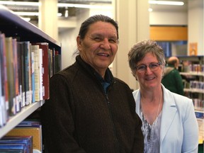 Wilson Bearhead, left, stands with Linda Garvin, executive director of customer experience with the Edmonton Public Library, at the Stanley A. Milner Library's temporary location at 10212 Jasper Ave. in Edmonton on Monday, April 3, 2017. Bearhead will be named the EPL's first elder in residence at a special ceremony on Friday, April 7, 2017.