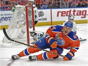 Zack Kassian of the Edmonton Oilers falls after missing the net against Martin Jones of the San Jose Sharks at Rogers Place in Edmonton on April 14, 2017. (Shaughn Butts)