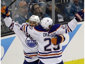 Edmonton Oilers' Zack Kassian, left, celebrates his goal wit teammate Leon Draisaitl (29) during the third period in Game 3 of a first-round NHL hockey playoff series against the San Jose Sharks Sunday, April 16, 2017, in San Jose, Calif.