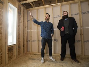 Municipal Affairs Minister Shaye Anderson gets a tour of an under-construction infill home from UrbanAge Homes' Richard Nault, in Edmonton Thursday May 4, 2017. Anderson announced the new New Home Buyer Protection Act during a news conference at the home.