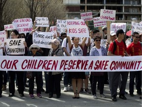 Members of the Chinese community and downtown residents protest the proposed concentration of safe injection sites in their neighbourhoods, outside city hall in Edmonton on Saturday May 6, 2017.