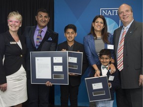 (left to right) Tracey Scarlett, Dean of the JR Shaw School of Business, Ashif Mawji, Kinza Mawji, 11, Zainul Mawji, Aariz Mawji, 7, and NAIT President and CEO Dr. Glenn Feltham pose for a photo after the Mawji family announced a $1 million donation to help establish the Mawji Centre for New Venture and Student Entrepreneurship at NAIT, in Edmonton Friday May 12, 2017.