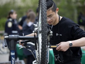 Wanyixiong Hua gives a bike a tune-up during a U-Cycle event at the University of Alberta in Edmonton Tuesday May 16, 2017.