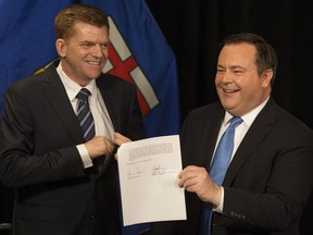 Wildrose Party leader Brian Jean and Alberta PC leader Jason Kenney announce that they have reached a deal to merge the parties and create the United Conservative Party, during a press conference in Edmonton Thursday May 18, 2017.