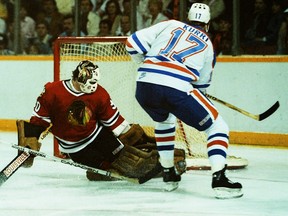 Chicago Black Hawks goalie Murray Bannerman watches the puck go into the net on a shot by Edmonton Oilers forward Jari Kurri during Game 1 of the Campbell Conference final on May 4, 1985, at Edmonton's Northlands Coliseum.