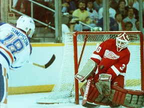 Edmonton Oilers forward Craig Simpson takes a shot on Detroit Red Wings goalie Greg Stefan on May 5, 1988, during Game 2 of the Campobell Conference final at Edmonton's Northlands Coliseum.