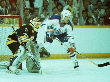 Boston Bruins goalie Andy Moog and Edmonton Oilers centre Mark Messier in action on May 26, 1988, during Game 4 of the Stanley Cup final at Northlands Coliseum.