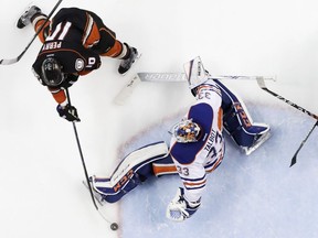 Anaheim Ducks right wing Corey Perry, left, scores the game winning goal past Edmonton Oilers goalie Cam Talbot during the fifth period in overtime in Game 5 of a second-round NHL hockey Stanley Cup playoff series in Anaheim, Calif., Friday, May 5, 2017.