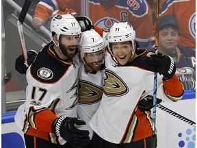 Anaheim Ducks Ryan Kesler (left) celebrates his third period goal with team mates Andrew Cogliano (middle) and Brandon Montour (right) during game action against the Edmonton Oilers in the third game of their National Hockey League Stanley Cup Playoffs series in Edmonton on April 30, 2017. Ducks won the game by a score of 6-3.