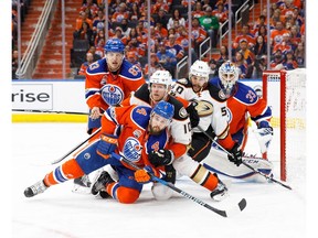 Matthew Benning #83 and Kris Russell #4 of the Edmonton Oilers battle against Corey Perry and Antoine Vermette of the Anaheim Ducks in Game Six of the Western Conference Second Round during the 2017 NHL Stanley Cup Playoffs at Rogers Place on May 7, 2017 in Edmonton, Alberta, Canada.