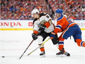 EDMONTON, AB - APRIL 30:  Connor McDavid #97 of the Edmonton Oilers battles against Rickard Rakell #67 of the Anaheim Ducks in Game Three of the Western Conference Second Round during the 2017 NHL Stanley Cup Playoffs at Rogers Place on April 30, 2017 in Edmonton, Alberta, Canada.