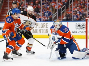 Matthew Benning and goalie Cam Talbot of the Edmonton Oilers defend the net against Nate Thompson of the Anaheim Ducks in Game Three of the Western Conference Second Round during the 2017 NHL Stanley Cup Playoffs at Rogers Place on April 30, 2017 in Edmonton.
