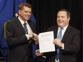 Alberta Wildrose leader Brian Jean, left, and Alberta PC leader Jason Kenney announce a unity deal between the two in Edmonton on Thursday, May 18, 2017.