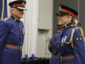 Const. Nathalie Perreault (right) shakes hands with Chief Rod Knecht (left) while receiving a Canadian Peacekeeping Service Medal during an Edmonton Police Service Recognition Ceremony at Edmonton Expo Centre in Edmonton, Alta. on Wednesday, May 17, 2017. Ian Kucerak / Postmedia (For Catherine Griwkowsky story)