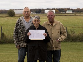 Len (l) and June O'Donnell (m) along with neighbour Wayne Csuhany (r) with a formal petition to the federal government to stop the operation and further development of the Parkland Airport, taken on Wednesday, October 5, 2016 in Parkland County. File photo.