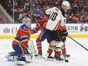 Anaheim Ducks' Corey Perry (10) tries to screen the net as Edmonton Oilers' goalie Cam Talbot (33) makes the save during the third period in game six of a second-round NHL hockey Stanley Cup playoff series in Edmonton on Sunday, May 7, 2017.