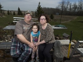 Dan Merriam, his daughter, Deeyah, 6, and wife Marilyn are pushing back against a proposed high-end gun range located a few hundred yards from there home, proposed by Kloovenburg Sports Ltd.