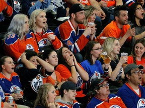 Dejected Edmonton Oilers fans watch their team play the Anaheim Ducks on the big screen at Rogers Place in Edmonton on Wednesday May 10, 2017. The Oilers lost the game by a score of 2-1 in game seven of their Stanley Cup playoff series in Anaheim, Calif. and are eliminated from the playoffs.