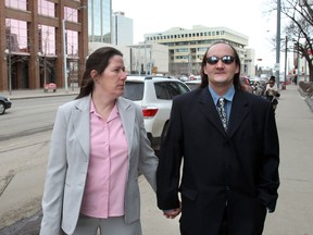Denise Margaret Scriven and her husband Michael Lee Scriven walk away from the downtown courthouse in Edmonton in a March 1, 2013, file photo.  The Scrivens had plead out on charges of manslaughter,  assault, unlawful confinement, and failing to preserve the necessities of life for Denise's sister Betty Anne Gagnon.