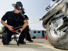 Const Michael Fehr tests the sound level of an a motorcycle during a voluntary decibel check event near Calgary trail and University Avenue. File photo.