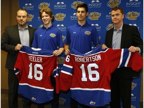 Edmonton Oil Kings Head Coach Steve Hamilton (left) and Edmonton Oil Kings General Manager Randy Hansch (right) welcome the team's two first round draft picks Liam Keeler and Matthew Robertson in Edmonton on May 16, 2016.