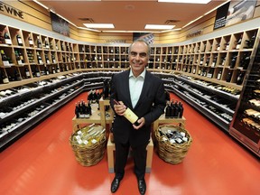 Liquor Stores chief executive Stephen Bebis is shown in the Capilano Mall Liquor Depot in this 2014 file photo. Liquor Stores N.A. Ltd. is fighting off an effort by PointNorth Capital Inc. to replace six of eight board members.