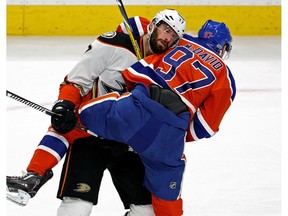 Edmonton Oiler Connor McDavid (right) is checked by Anaheim Duck Ryan Kesler (left) during the fourth game of their Stanley Cup playoff series in Edmonton on Wednesday May 3, 2017. The Ducks defeated the Oilers in overtime by a score of 4-3 to tie the series 2-2.