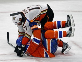 Edmonton Oilers forward Jordan Eberle (bottom) is checked by Anaheim Ducks centre Ryan Kesler during the fourth game of their Stanley Cup playoff series in Edmonton on May 3, 2017.