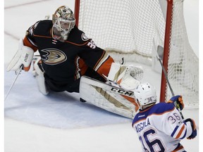 Edmonton Oilers center Drake Caggiula, right, scores under Anaheim Ducks goalie John Gibson during the second period in Game 5 of a second-round NHL hockey Stanley Cup playoff series in Anaheim, Calif., Friday, May 5, 2017.