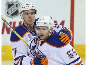 Edmonton Oilers center Mark Letestu, right, is hugged by Connor McDavid after scoring against the Winnipeg Jets in Winnipeg on Dec. 1, 2016. (Brian Donogh)