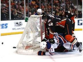 Josh Manson #42 of the Anaheim Ducks checks Connor McDavid #97 of the Edmonton Oilers in Game Seven of the Western Conference Second Round during the 2017 NHL Stanley Cup Playoffs at Honda Center on May 10, 2017 in Anaheim, California.