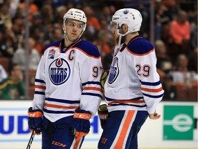 Edmonton Oilers captain Connor McDavid talks with linemate Leon Draisaitl during Game 2 otheir NHL playoff series against the host Anaheim Ducks at Honda Center on April 28, 2017.