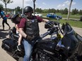 John Markwart gives a ride to Emry Blanchard, 3, during the Parade of Heroes put on by the Kids with Cancer Society on Saturday May 27, 2017, at Hawrelak Park in Edmonton.  Since 2006, this family event has provided children touched by cancer with a family barbecue and the opportunity to experience the thrill of riding on a motorcycle in a safe and spirited environment.